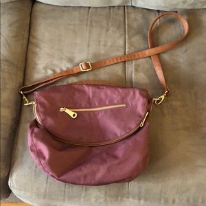 Nylon plum colored cross body bag with gold detail